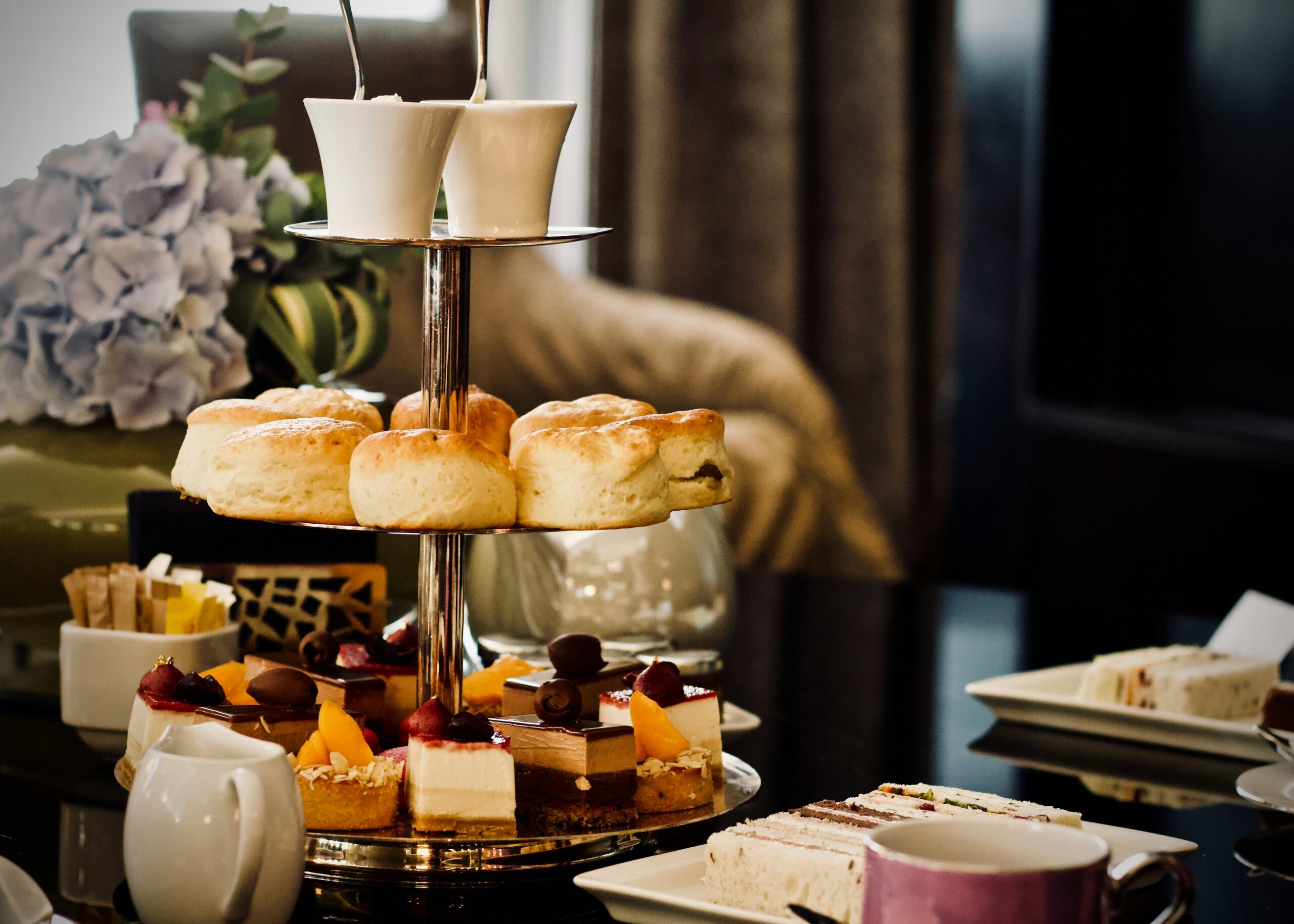 Afternoon tea in Edinbrugh Dalhousie Castle Hotel Blog Image of afternoon tea with scones on a cake stand 